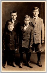 c1910 RPPC Real Photo Postcard Four Young Men In Suits Standing