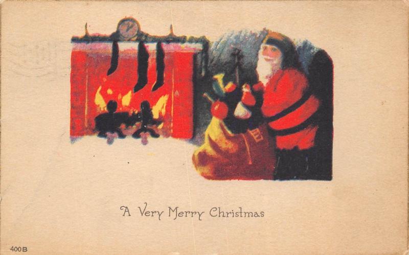 Merry Christmas 1910 Postcard Fireplace with Stockings Santa Claus Bag of Toys