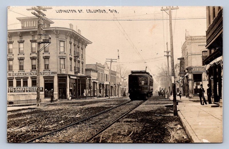 J90/ Columbus Wisconsin RPPC Postcard c1910 Ludington St Trolley Stores  304