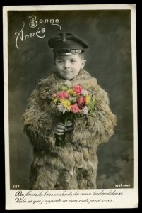 Bonne Annee. Boy in fur coat and cap. Alfred Noyer studio RPPC. Hand tinted