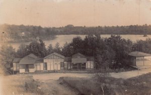 CAMP CABINS ON LAKE-MESSAGE ON BACK~1910s REAL PHOTO POSTCARD