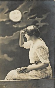 French RPPC Man in Full Moon sees Pretty Girl w/ Book Looking Out 1634/1