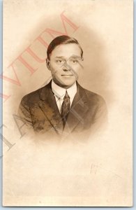 c1920s Detroit, MI Handsome Young Man Portrait RPPC Smirk Real Photo Studio A193