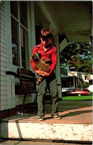 Vermont Roxbury Young Boy With Raccoon