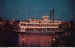 DISNEYLAND, 1950s-60s; Night time trip on the Mark Twain paddle-wheel Steamboat