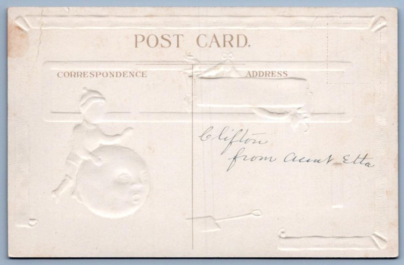 1910's CHRISTMAS BOY ROLLS WORRIED SNOWMAN HEAD EMBOSSED ANTIQUE POSTCARD