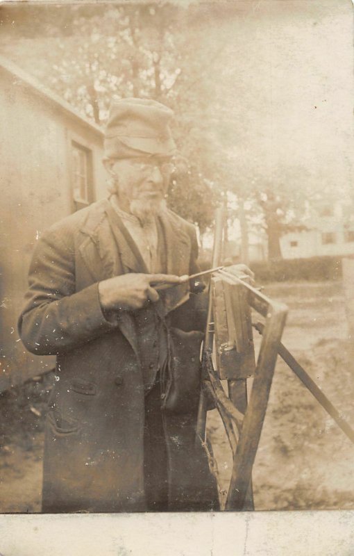 H64/ Interesting RPPC Postcard c1910 Old Man Sharpening Blades File 21