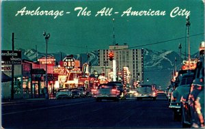 Vtg 4th Avenue Street View Dusk Classic Cars Signs Anchorage Alaska AK Postcard