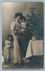 MOTHER w/ GIRLS at CHRISTMAS TREE ANTIQUE REAL PHOTO POSTCARD RPPC toy horse