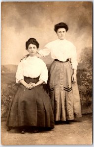 Two Young Women in White Blouse with Long Dark Dress Portrait, RPPC Postcard