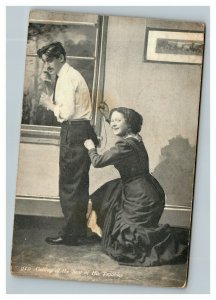 Vintage 1911 Photo Postcard - Woman Sews Husbands Pants While Wearing Them