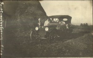 Early Car & Huge Hay Stack - 5 Mi East of Ft. Wayne Written on Back c1910 RPPC