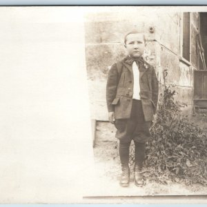 c1910s Handsome Young Man Outdoors RPPC Stone House w Knickerbockers Bowtie A213