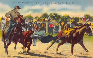 Bruce Ross Bulldogging at Leo J Cremer's Rodeo Colorado State Fair, Pueblo, C...