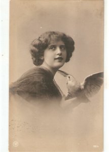 Young lady holding a dove  Nice old vintage postcard