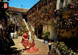 Spain Cordoba Courtyard With Locals In Traditional Dress