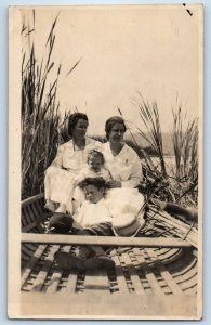 c1910's Women With Baby Child Riding Boat Cattails RPPC Photo Antique Postcard