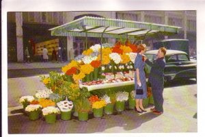 Woman Buying Flowers at Street Stall. San Francisco, California