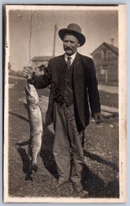K45/ Houghton Lake Michigan RPPC Postcard c1910 Large Fish Caught Man 320