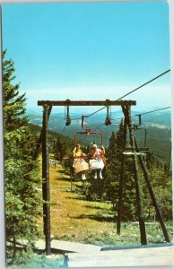 Terry Peak Chair Lift  women in skirts riding - Lead Deadwood South Dakota