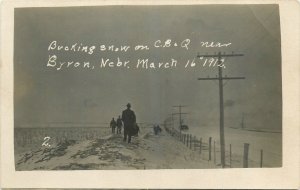 1912 Bryon Nebraska railroad Bucking snow RPPC Postcard 26-707