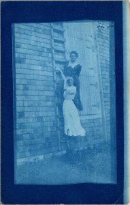 Cyanotype Real Photo Postcard Two Women Standing on Large Ladder Outside a Barn