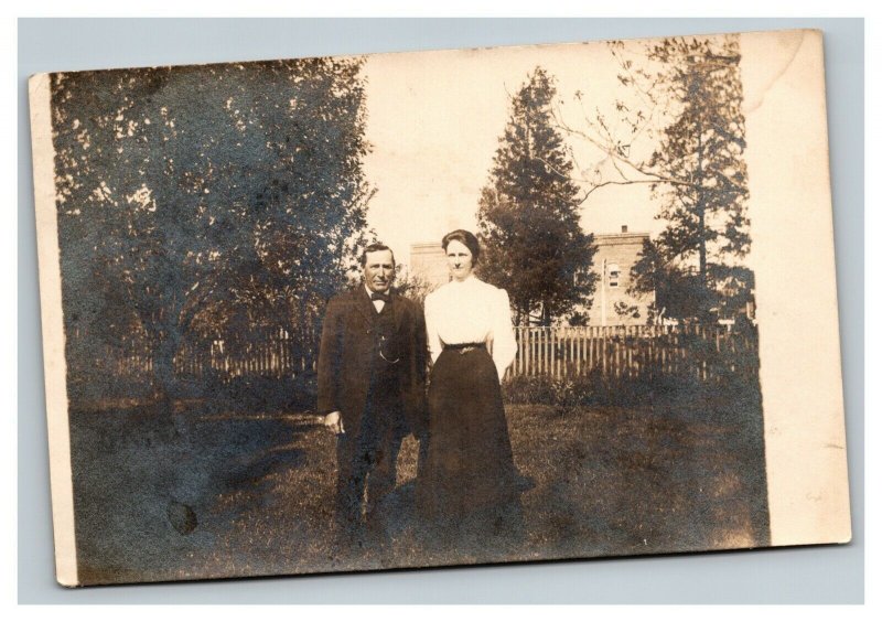 Vintage 1910 RPPC Postcard - Couple in Country Garden Big House in Distance