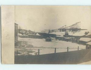 Pre-1920's rppc TOWER STRUCTURES BEHIND YARD FOR LIGHT INDUSTRIAL USE HM0614