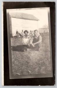 RPPC Young Couple in the Grass on the Farm Woman Man Postcard B30