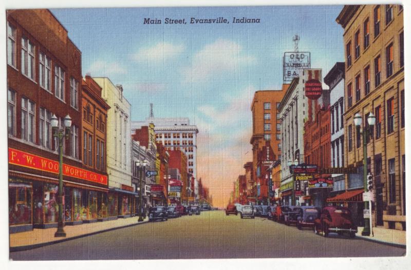 P421 JL linen postcard f.w. wool worth many signs old cars evansville indiana