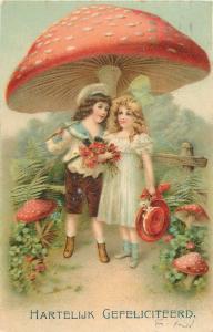 Victorian children couple under mushroom fantasy postcard 1912