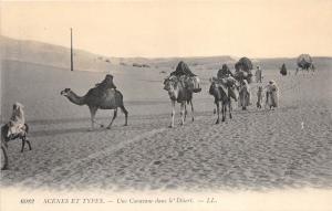 B91449 types une caravane dans le desert folklore chamel africa