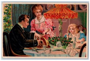 c1910's Merry Christmas Family Dinner Ham Holly Berries Embossed Postcard