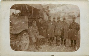 RPPC Postcard WWI Soldiers Stand Near Truck 1 Feminine Different Clothes Woman?
