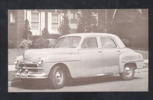 1950 PLYMOUTH DELUXE 4 DOOR SEDAN VINTAGE CAR DEALER ADVERTISING POSTCARD