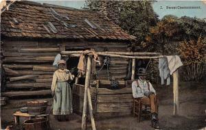 11519   Black couple outside their log home