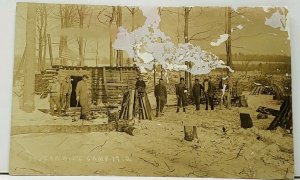 RPPC Stuerwald's Camp 1912 Loggers Men Tools Logging & US Flag Postcard H17