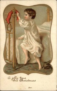 Christmas Little Boy with Stocking Brass Bed c1910 Vintage Postcard