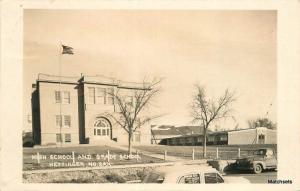 1938 HETTINGER NORTH DAKOTA High Grade School RPPC postcard 100664 automobiles