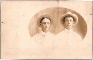 RPPC Two young men in white shirts and hats