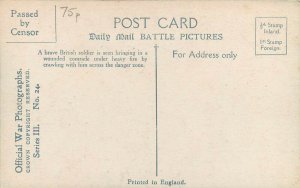 The hero saving a wounded comrade under fire official war photographs postcard