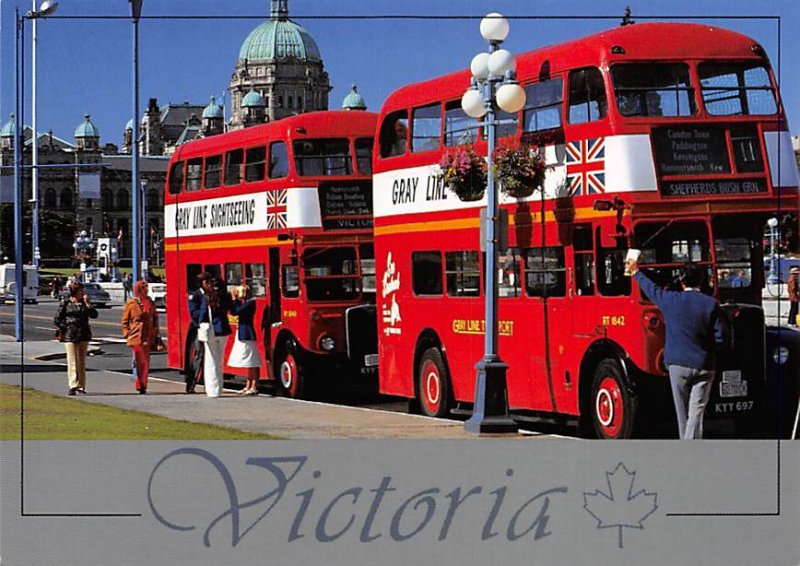 London double-decker buses take visitors on scenic tours through Victoria Bus...