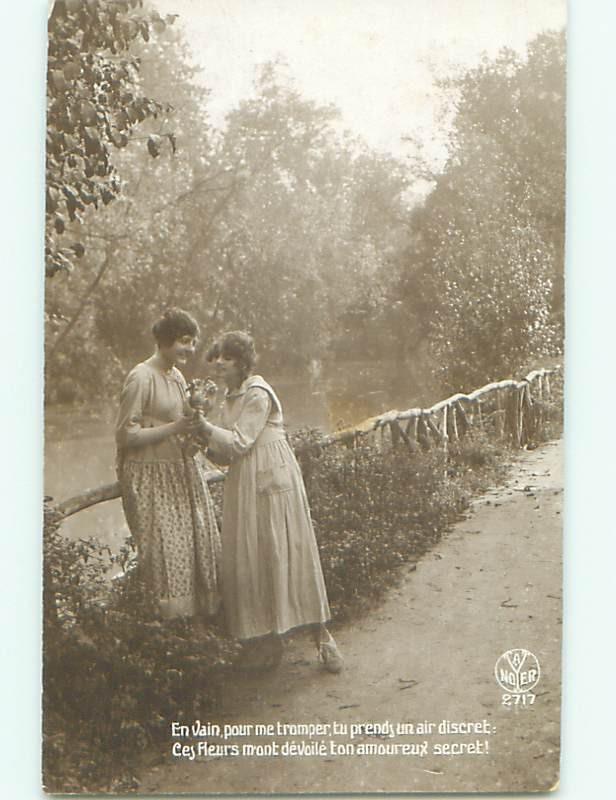 rppc c1910 WOMEN BY RAILING ALONG RIVER AC8647