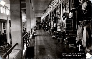 RPPC Postcard Mexico Juarez Market Clothing Section Salesmen 1940s S115