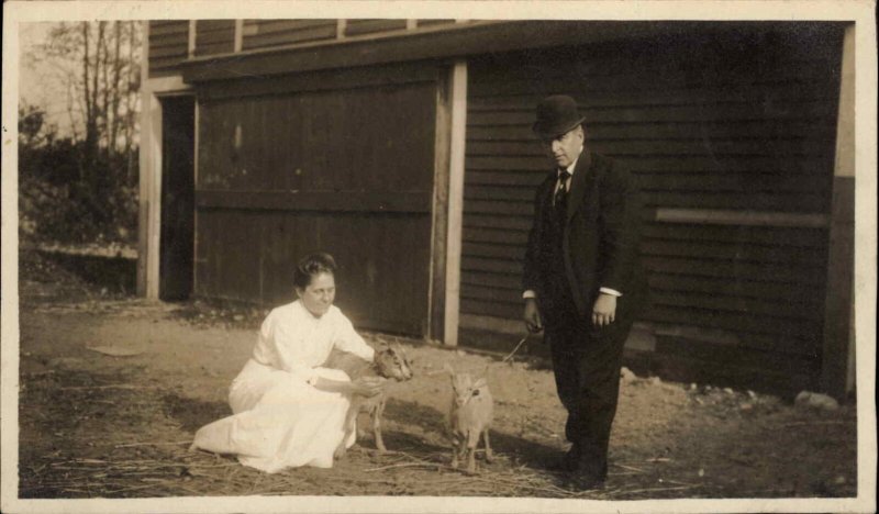 Fancy Man in Bowler Hat and Woman with Baby Goats Real Photo c1910 Postcard