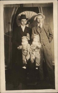 Bizarre Unusual Studio Image Gay Interest? Men w/ Dolls & Parasol c1910 RPPC