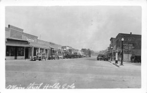 H65/ Holly Colorado RPPC Postcard c1940 Main Street Stores Automobiles 64