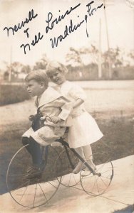 NEWELL & NELL LOUISE WADDINGTON ON TRICYCLE~1911 RPPC PMK SAN ANTONIO TX