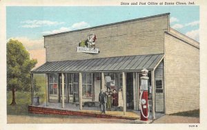 STORE & POST OFFICE AT SANTA CLAUS INDIANA GAS STATION POSTCARD (c. 1920)