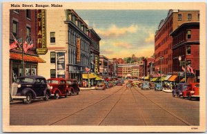 VINTAGE POSTCARD ROWS OF PARKED CARS AND STORE SIGNAGE MAIN STREET BANGOR MAINE